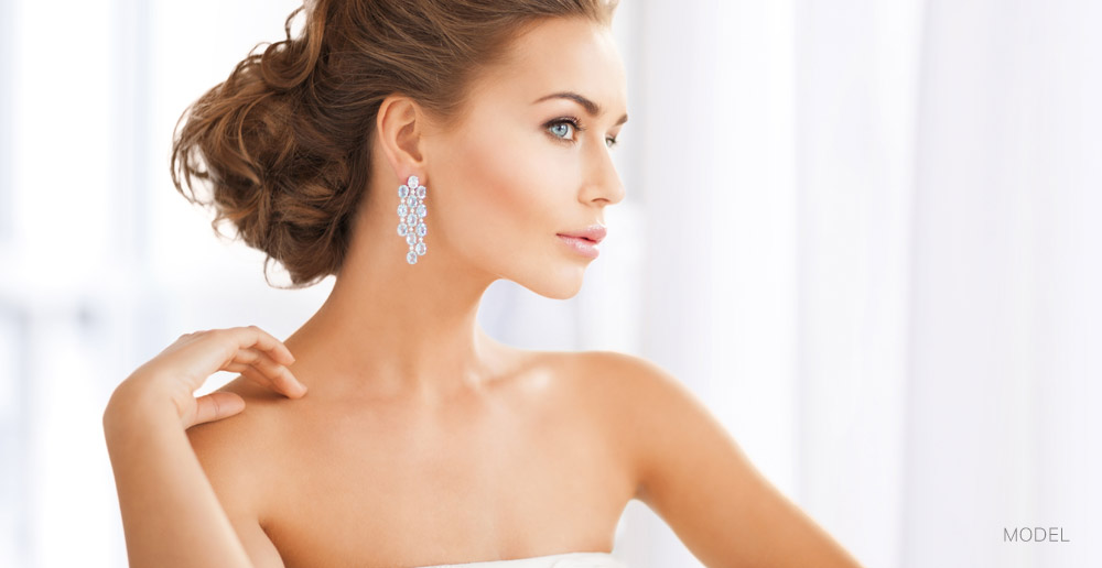 Woman with Clear Beautiful Skin Wearing Diamond Earrings